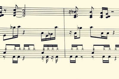 A sheet music with notes and different shapes.